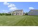 Backyard featuring lush green lawn and mature trees at 543 Amersham Ct, Avon, IN 46123