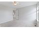 Bright bedroom features neutral walls, carpet, ceiling fan, and door leading to other rooms at 543 Amersham Ct, Avon, IN 46123