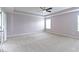 Bright primary bedroom boasts neutral walls, plush carpet, and a ceiling fan at 543 Amersham Ct, Avon, IN 46123