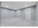 Carpeted bedroom with neutral paint, white trim and plentiful recessed lighting at 543 Amersham Ct, Avon, IN 46123