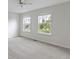 Bright bedroom features neutral walls, carpet, and two large windows with bright light at 543 Amersham Ct, Avon, IN 46123