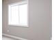 Bedroom window with natural light, carpeted flooring, and neutral paint at 543 Amersham Ct, Avon, IN 46123