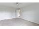 Bright bedroom features neutral walls, carpet, and door leading to other rooms at 543 Amersham Ct, Avon, IN 46123