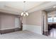 Bright dining room featuring decorative trim, light fixtures and hardwood floors at 543 Amersham Ct, Avon, IN 46123