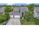 Beautiful brick home showcasing a well maintained lawn and three-car garage at 543 Amersham Ct, Avon, IN 46123