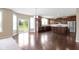 An open kitchen and dining area with stainless appliances and a view to the outdoors at 543 Amersham Ct, Avon, IN 46123