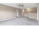 Spacious upstairs bonus room with plush carpet and a ceiling fan for comfort at 543 Amersham Ct, Avon, IN 46123