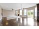 An open living space featuring wood floors, a fireplace, and abundant natural light at 543 Amersham Ct, Avon, IN 46123
