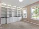 Bright office featuring built-in shelving and two windows providing natural light at 543 Amersham Ct, Avon, IN 46123