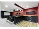 Home theater room with projector, bar, mini fridge, carpet, and leather seating at 543 Amersham Ct, Avon, IN 46123