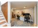 Finished basement featuring wood stairs, an area rug, and an office space with desk and monitors at 5616 Winthrop Ave, Indianapolis, IN 46220
