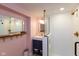 Stylish bathroom features a modern vanity, walk-in shower, and tasteful decor with a unique mirror and hooks at 5616 Winthrop Ave, Indianapolis, IN 46220