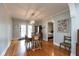 Bright dining room featuring hardwood floors and stylish lighting at 5616 Winthrop Ave, Indianapolis, IN 46220