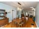 Open dining room with hardwood floors connected to the living area at 5616 Winthrop Ave, Indianapolis, IN 46220