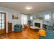 Cozy living room featuring hardwood floors and a fireplace at 5616 Winthrop Ave, Indianapolis, IN 46220