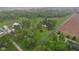 Gorgeous aerial view of a countryside home surrounded by trees, farmland, and outbuildings at 6012 S 625 W, Pendleton, IN 46064