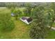 Aerial view of the property, with sprawling green lawn and mature trees at 6012 S 625 W, Pendleton, IN 46064