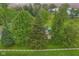 Picturesque aerial view of a property with lush green trees and a white fence at 6012 S 625 W, Pendleton, IN 46064