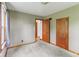 This bedroom features two large closets, baseboard trim, and carpeting at 6012 S 625 W, Pendleton, IN 46064