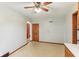 Bright dining room with a ceiling fan, arched doorway, and views into adjacent rooms at 6012 S 625 W, Pendleton, IN 46064