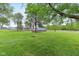 Quaint building set on a large green lawn surrounded by mature trees at 6012 S 625 W, Pendleton, IN 46064