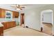 Cozy eat-in kitchen features wood cabinetry and a ceiling fan for added comfort at 6012 S 625 W, Pendleton, IN 46064