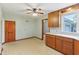 Eat in kitchen featuring vinyl flooring, wood cabinets, and bright lighting at 6012 S 625 W, Pendleton, IN 46064