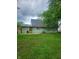 View of the home's backyard featuring a lawn and back of the house at 6117 Marilyn Rd, Indianapolis, IN 46226
