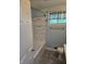 Updated bathroom with subway tile surround, modern fixtures, and tiled flooring at 6117 Marilyn Rd, Indianapolis, IN 46226