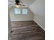 Spacious bedroom featuring a ceiling fan, wood floors, and natural light at 6117 Marilyn Rd, Indianapolis, IN 46226