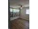 Bedroom featuring wood floors, a ceiling fan, and a window with blinds at 6117 Marilyn Rd, Indianapolis, IN 46226