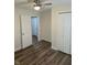 Bedroom with updated flooring and a view into another room at 6117 Marilyn Rd, Indianapolis, IN 46226