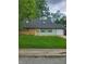 Charming single-story home with a well-manicured lawn and a bright yellow front door at 6117 Marilyn Rd, Indianapolis, IN 46226