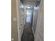 Hallway view with carpet and neutral paint leading into bedroom at 6117 Marilyn Rd, Indianapolis, IN 46226