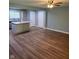 Open-concept living area with wood floors, connecting to a kitchen with a center island at 6117 Marilyn Rd, Indianapolis, IN 46226