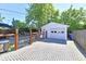 Spacious backyard featuring a detached garage, hot tub, and ample parking at 6187 Crittenden Ave, Indianapolis, IN 46220