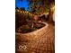 Picturesque backyard featuring a stone-lined pond with a small waterfall and patio at 6187 Crittenden Ave, Indianapolis, IN 46220