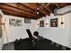 Workout room with exercise equipment, exposed ceiling, and stylish decor at 6187 Crittenden Ave, Indianapolis, IN 46220