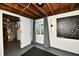 Finished basement featuring painted walls, a window, modern lighting, and a decorative map of Indianapolis neighborhoods at 6187 Crittenden Ave, Indianapolis, IN 46220