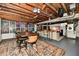 Entertaining space with exposed wood ceiling, bar seating, dining area, and a comfortable lounge at 6187 Crittenden Ave, Indianapolis, IN 46220
