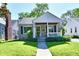 Charming single-Gathering home with stone accents, covered porch, and well-manicured lawn at 6187 Crittenden Ave, Indianapolis, IN 46220
