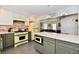 Bright, updated kitchen with retro yellow appliances and center island with seating at 6187 Crittenden Ave, Indianapolis, IN 46220