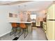 Charming kitchen with stylish cabinets, stainless appliances, breakfast bar, and modern lighting at 6187 Crittenden Ave, Indianapolis, IN 46220