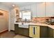 Updated kitchen featuring white countertops, a farmhouse sink, and vintage yellow dishwasher at 6187 Crittenden Ave, Indianapolis, IN 46220
