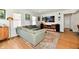 Cozy living room featuring a large sectional, vintage entertainment center, and stylish decor at 6187 Crittenden Ave, Indianapolis, IN 46220