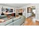 Bright living room with hardwood floors, views into other rooms, and modern entertainment center at 6187 Crittenden Ave, Indianapolis, IN 46220