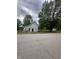 View of an under-construction home along a residential street with mature trees at 6326 N Main St, Wilkinson, IN 46186