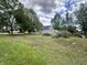 View of an under-construction home featuring a large yard with tree coverage at 6326 N Main St, Wilkinson, IN 46186