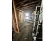 Interior view of a home under construction featuring exposed studs, beams, and open space at 6326 N Main St, Wilkinson, IN 46186