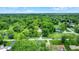 Panoramic aerial view of a home and its mature tree setting at 6430 E Southport Rd, Indianapolis, IN 46237